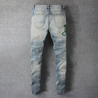 Serpent Strike Distressed Jeans